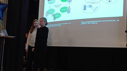 students on a stage presenting