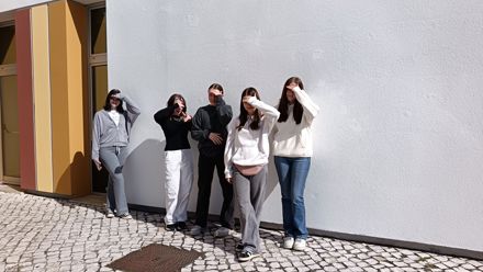 students in front of a wall