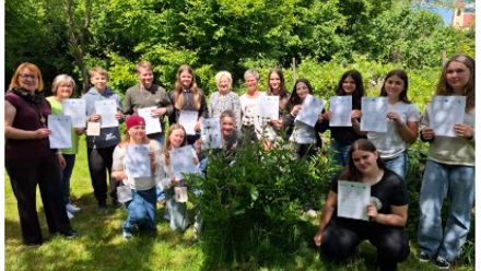 group of students with certificates