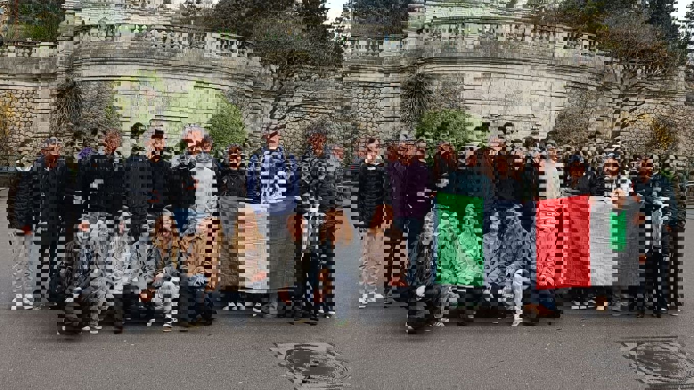 students in front of a church