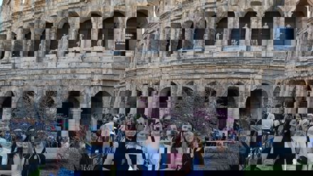 kids in front of a colloseum
